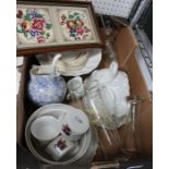 A box containing a selection of useful domestic items.