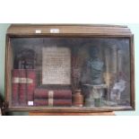 Shakespeare - A display case of his works and a small bust.