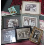 A box of vintage pictures and prints.