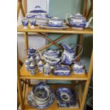 Three shelves containing a good selection of Spodes Italian tablewares