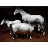 A set of three dapple grey Beswick horses, A/F