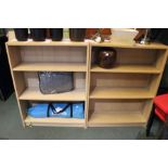 A pair of wood effect open fronted adjustable shelves.