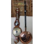 A 19th century mahogany framed barometer, with a copper warming pan, ebonised handle.
