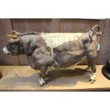 A Raku ware bull, 61cm nose to tail