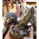 A Balinese carved and painted wood dragon