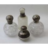 A pair of Victorian, silver mounted cut glass scent bottles, the covers by John Grinsell and sons, B