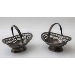 George Nathan and Ridley Hayes, a pair of small silver bon-bon baskets, with swing handles and pierc