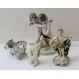 A scallop form salt, Chelsea type putti, cactus vase and Capo wrestling putti