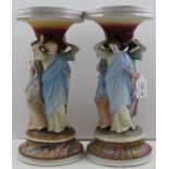 A pair of Continental ceramic centrepieces, classical figure stems, painted in polychrome, c.1900, 3