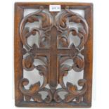 A Continental carved oak panel, pierced decoration, depicts acanthus scrolls about a cross, 37cm x