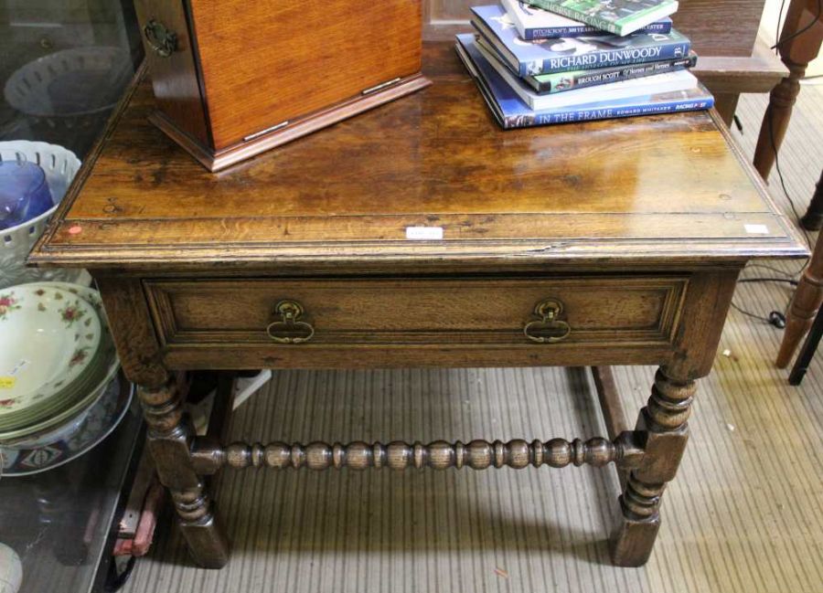 A part 19th century oak side table turned and blocked legs with single drawer, bobbin turned stretch