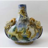 A ontinental majolica vase, of tear drop form, having satyr masks to the shoulders, painted with sc