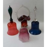A cranbery glass bell having a green glass handle, 31cm high, together with one other glass bell, a