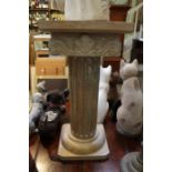A limed wood carved pillar jardiniere stand, 72cm high x 34cm square