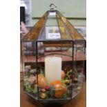 An octagonal hanging terrarium.