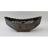 William Aitkin, an Edwardian silver basket of boat form, pierced decoration, raised on four ball fee
