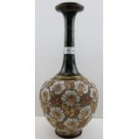 A Doulton & Slaters stoneware vase, impressed floral body, with tapering green mottled neck,