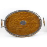An Edwardian oval oak tea tray with silver plated gallery, base 52cm x 32cm