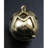 A 9ct gold Masonic orb pendant, opens to reveal six silver gilt pyramids, engraved with symbols, gro