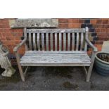 A two person slatted bench.