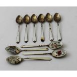 Adie Brothers Ltd, a set of six silver and enamel coffee spoons, London 1962, together with four oth