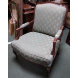 A Continental design, show wood open arm framed easy chair, with green ground upholstery