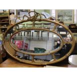 A fancy gilt framed oval mirror A/F