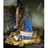Companion set in the form of a Knight, gilt mirror and a model boat.