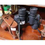 Nikon binoculars and a Leica branded camera case.