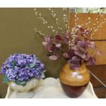 two decorative indoor pots with everlasting flowers