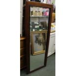 A mahogany framed bevel robing mirror