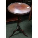 Mahogany wine table on cluster column and three out swept legs.