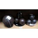 A selection of Canon balls - one single large ball and two groups of smaller bore examples.