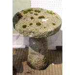 a concrete small staddle stone