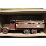 A scratch built model of a timber truck with log load on the flatbed. 74 x 20 cm.