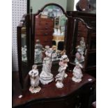 A mahogany framed triple dressing table mirror, together with a mahogany veneered bookcase, fitted s