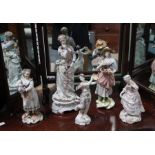 Five porcelain female figurines.