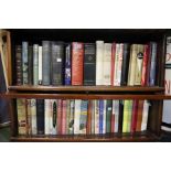 Two shelves of second hand reference books.