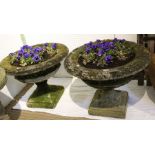 A pair of decorative urn form garden planters, 75cm diameter by 60cm high