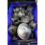 A box of pewter wares, includes lidded tankards