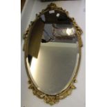 A gilt framed oval bevel plate wall mirror
