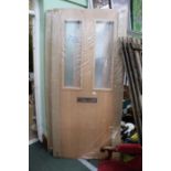 Two hardwood external doors (still in packaging)