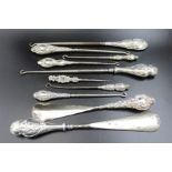 Ten various silver handled shoehorns and button hooks
