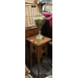 A small carved four legged side table together with a large brass vase
