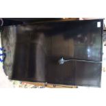 A JVC 43 inch smart 4K flat screen television on wall bracket