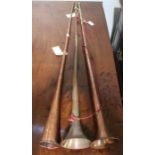 Three copper coaching horns.