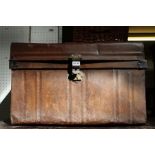 A tin travel trunk with side handles & flat top