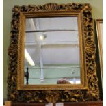A shell gilt framed plain plate mirror