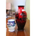 A Royal Doulton flambe vase with rural scene, 28.5cm high, together with a Maling floral brush pot,