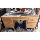 An oak twin pedestal desk, 138cm wide